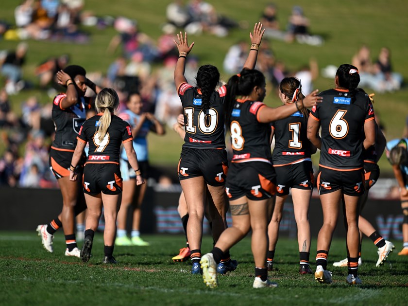 Wests Tigers celebrate their Round 2 victory over the Sharks at Belmore.