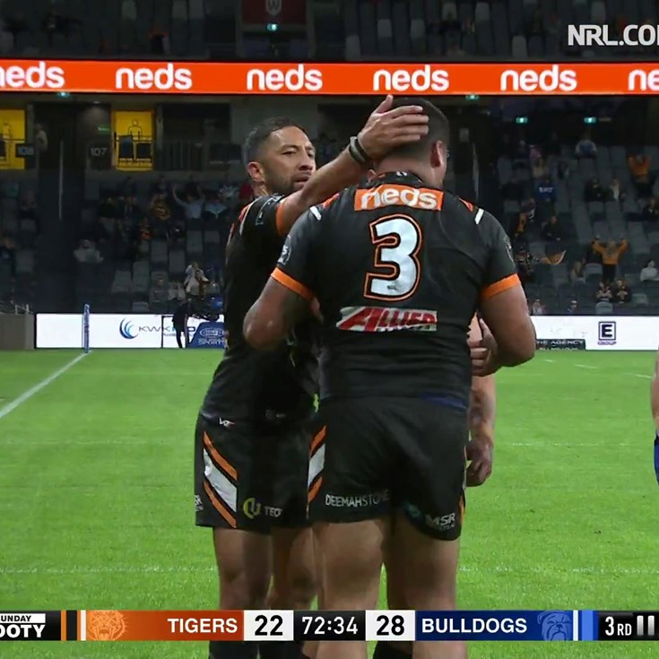 Joey Leilua fends his way over to get the Wests Tigers back level