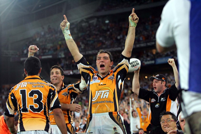 Skandalis celebrates Wests Tigers maiden premiership in 2005 