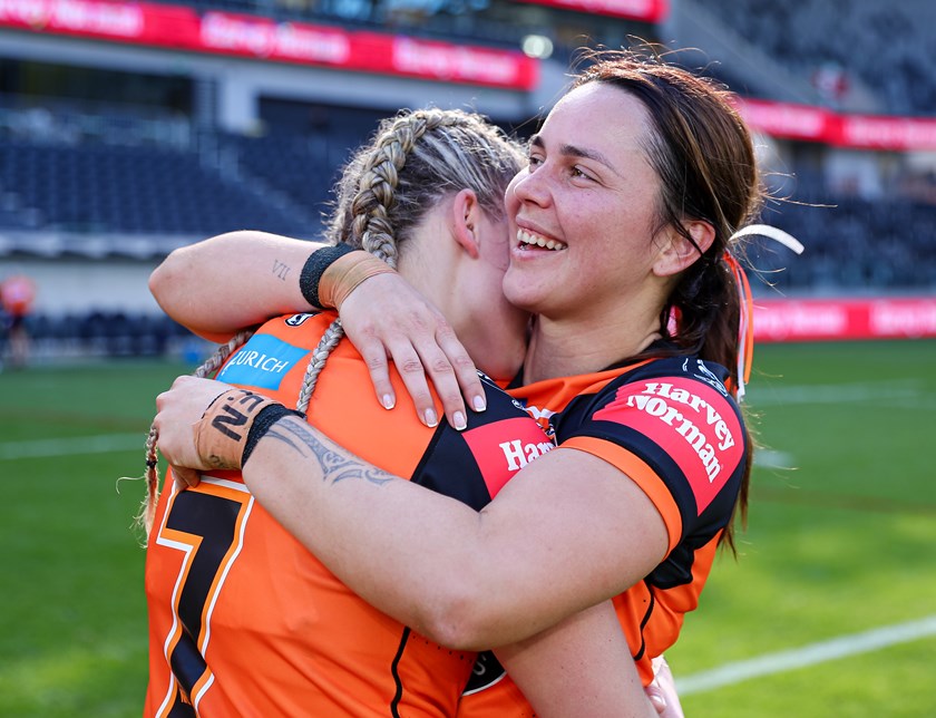 Vette-Welsh embraced by halfback Emily Curtain  