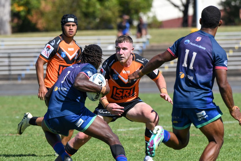 Brandon Tumeth looks to tackle a Silktails player