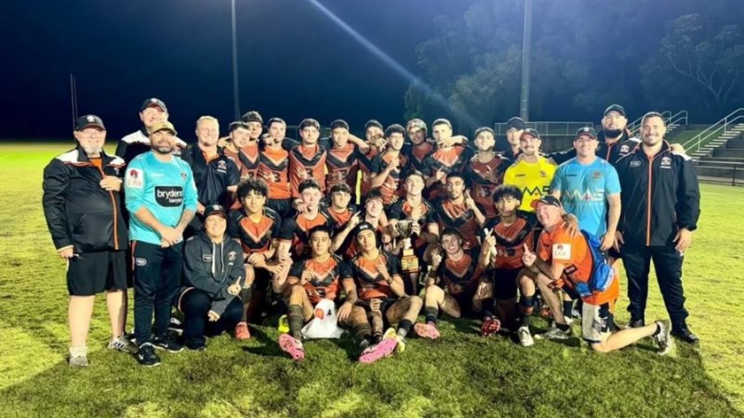 Wests Tigers White Cubs players and staff with the Anthony Laffranchi Cup