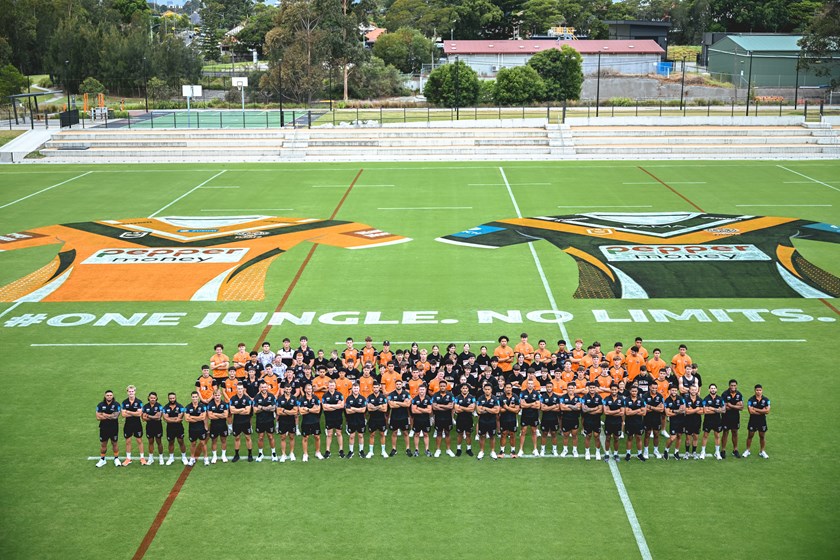 NRL squad with pathways players and local students who helped unveil new jerseys